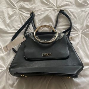 This bag was never worn it has straps like a book bag and black leather.